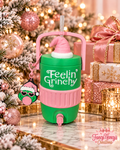 Green Feelin' Grinchy cooler with pink handle, textured pink band and spout, pink Santa hat straw topper and Grinch can tab assist opener keychain.